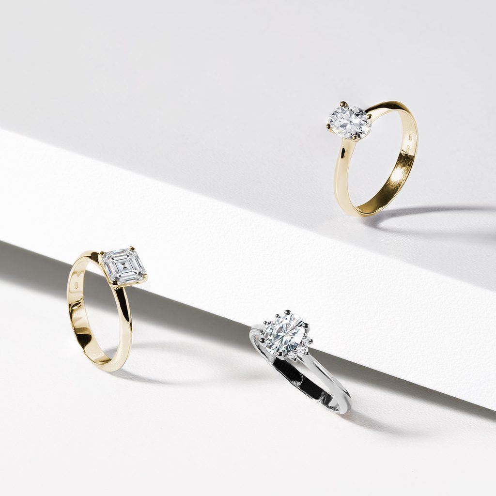 WHITE GOLD OVAL DIAMOND RING WITH SIDE DIAMONDS - DIAMOND ENGAGEMENT RINGS - ENGAGEMENT RINGS
