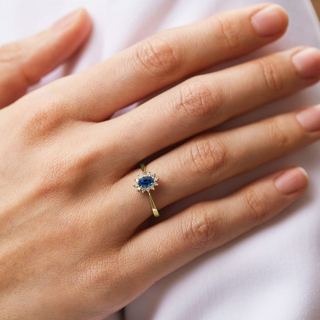 OVAL SAPPHIRE AND DIAMOND RING IN GOLD - SAPPHIRE ENGAGEMENT RINGS - 