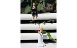 Bridegroom with a rod catching the bride 3+1 free - wedding cake figurines
