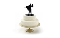 Silhouette of newlyweds in arms - wedding cake figures