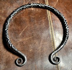 TWISTING IRON TORC