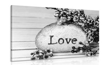 CANVAS PRINT WITH THE INSCRIPTION "LOVE" ON A STONE IN BLACK AND WHITE - BLACK AND WHITE PICTURES - PICTURES