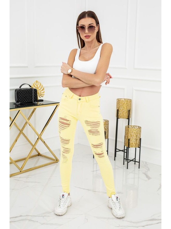 Skinny jeans s trháním ve žluté barvě