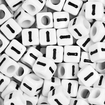 White plastic bead 7 mm with letter I