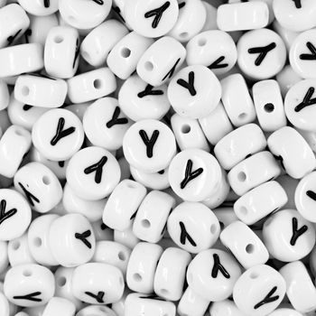 White plastic bead 7x4 mm with letter Y