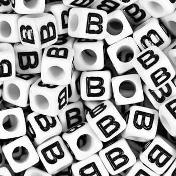 White plastic bead 7 mm with letter B