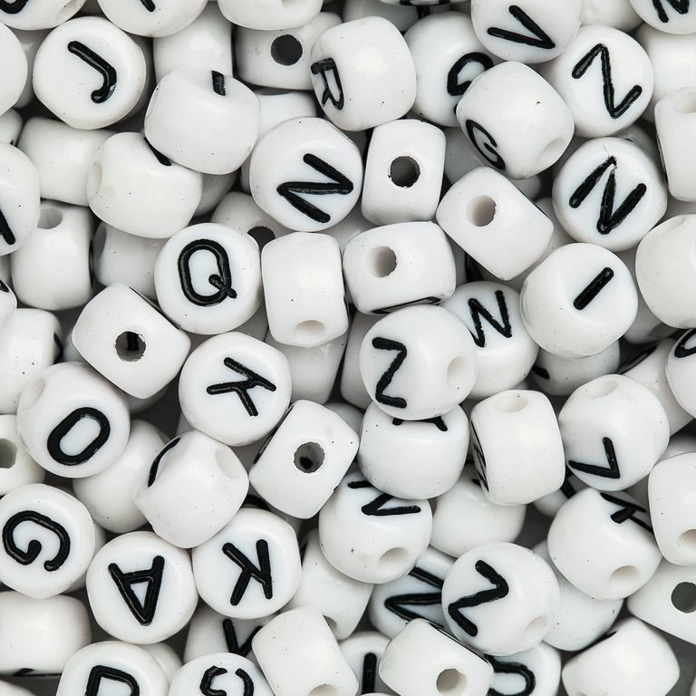 White mix of plastic beads 7x5 mm with letters