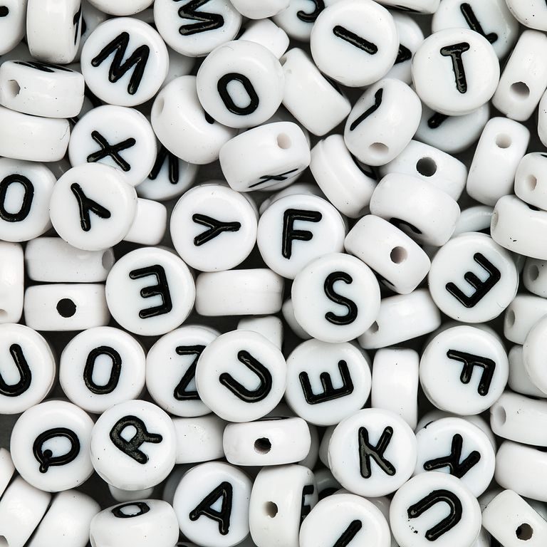 White mix of plastic beads 7x4 mm with letters