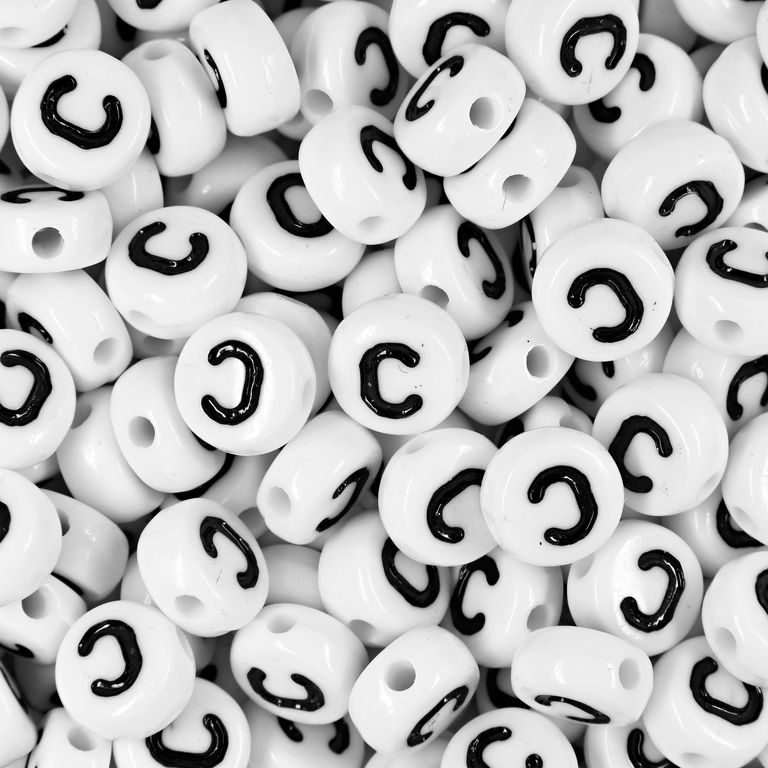 White plastic bead 7x4 mm with letter C