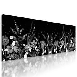 Obraz lúka plná kvetov v čiernobielom prevedení