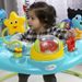 BABY EINSTEIN SKÁKADLO/AKTIVNÍ CENTRUM 2V1 CURIOSITY COVE™ 6M+ DO 11KG - VOZÍTKA A ODRÁŽEDLA - PRO DĚTI