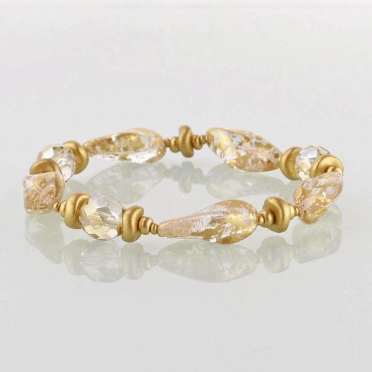 Náramek ze skleněných kamenů čirý/zlatý pokov