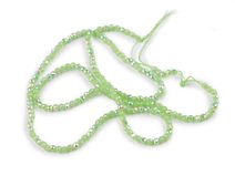 Skleněné korálky broušené ohňovky 2 mm s AB efektem, na šňůrce