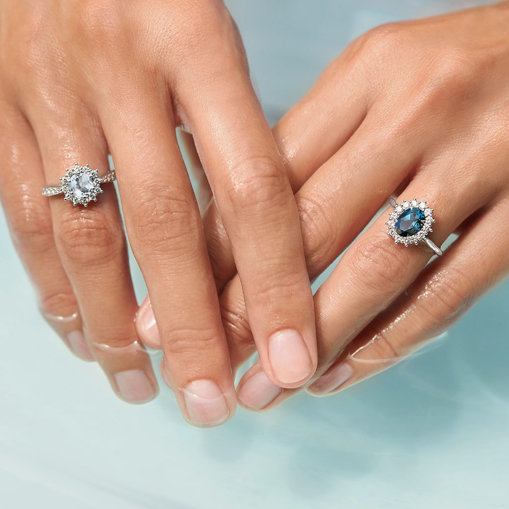 Aquamarine and diamond halo ring in white gold | KLENOTA