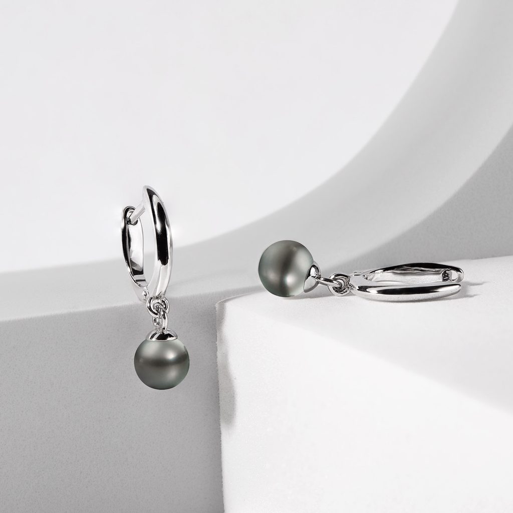 Diamond Essence Designer Earring with round brilliant melee and 10-11 mm black  Pearl. Perfect for all occasions, 0.4 Cts. T.W. in Platinum Plated Sterling  Silver.