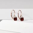 Earrings made of pink gold with garnets and diamonds