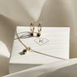 GRANATSET MIT BANDMOTIV IN GELBGOLD - SCHMUCK SETS EDELSTEINE - SCHMUCK