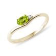Oval peridot ring with diamonds in gold
