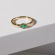 Oval emerald ring in yellow gold