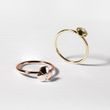 Pierścień wykonany z różowego złota z diamentem i trefoil