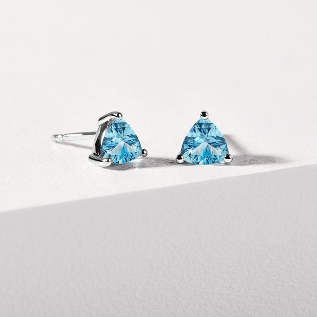 Trillion cut topaz stud earrings in white gold