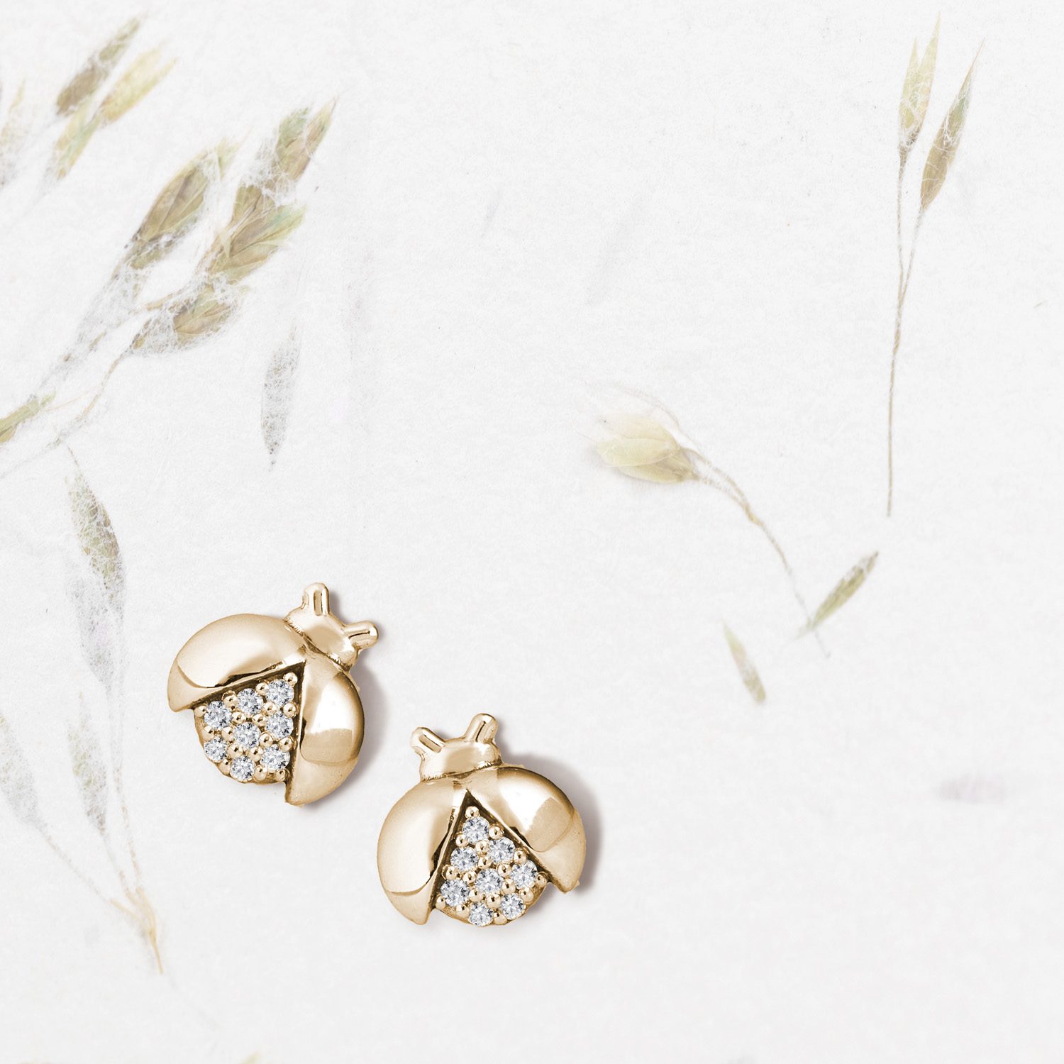 gold earrings with diamonds in ladybird motif - KLENOTA