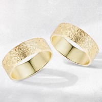 Yellow gold wedding rings with special surface
