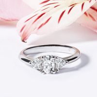 White gold engagement ring with oval and heart shaped diamonds