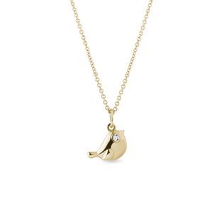 Bird pendant with a diamond in gold