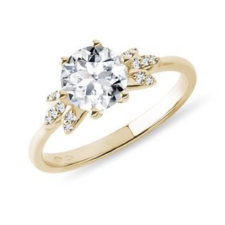 Moissanite and diamond ring in yellow gold
