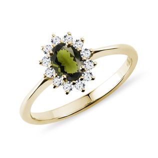 Oval moldavite and diamond ring in yellow gold