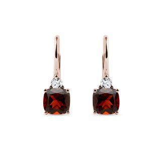 Earrings made of pink gold with garnets and diamonds