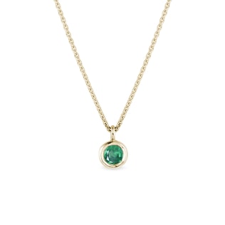 Bezel emerald necklace in yellow gold