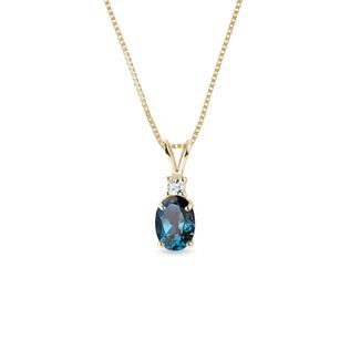 Radiant topaz and diamond necklace in yellow gold