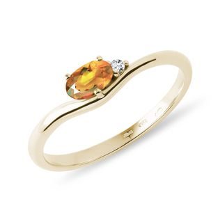 Oval citrine ring with diamonds in gold