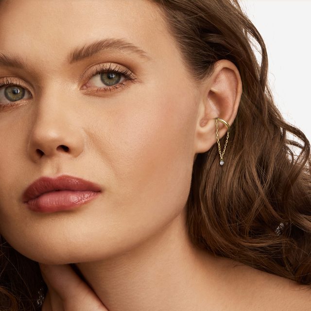 YELLOW GOLD SINGLE EAR CUFF WITH A DIAMOND AND CHAIN - EAR CUFFS - 