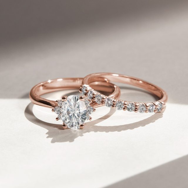 ROSE GOLD OVAL DIAMOND RING WITH SIDE DIAMONDS - DIAMOND ENGAGEMENT RINGS - 