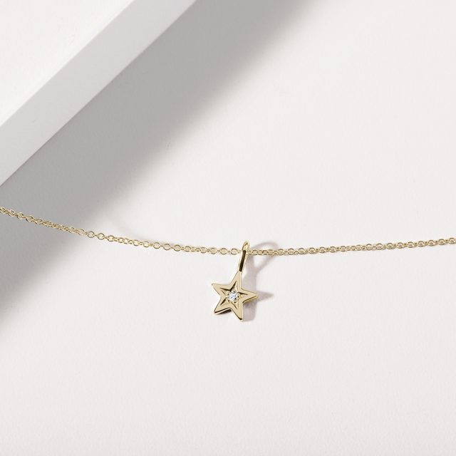STAR PENDANT WITH A DIAMOND IN YELLOW GOLD - PENDANTS - 