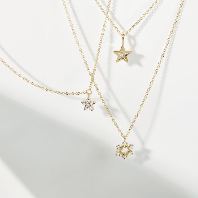 STAR PENDANT WITH A DIAMOND IN YELLOW GOLD - PENDANTS - 