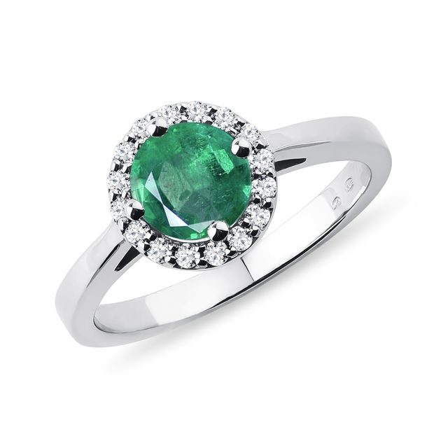 Emerald and diamond halo ring in white gold