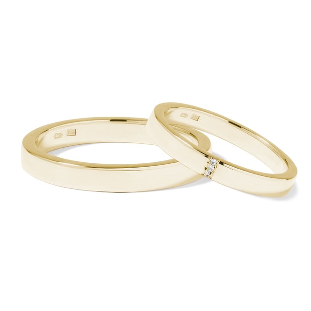 Wedding rings with three diamonds in yellow gold