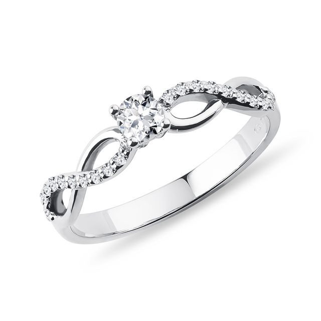 RING WITH A CENTRAL DIAMOND AND INFINITY SYMBOLS - DIAMOND ENGAGEMENT RINGS - ENGAGEMENT RINGS