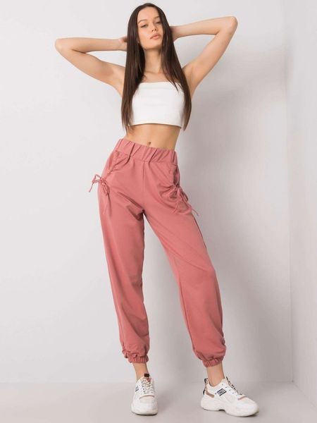 Pudrově růžové tepláky s volánky