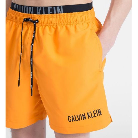 Pánské plavky CALVIN KLEIN Medium Double 803 oranžové - CALVIN KLEIN -  šortky a delší plavky - Plavky, PRO MUŽE - SILENTE.cz - Pohodlné noční  prádlo, župany a spodní prádlo pro Váš pohodový den!