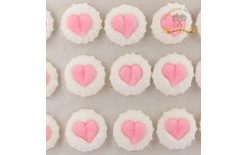 White meringue sugar decorations with hearts