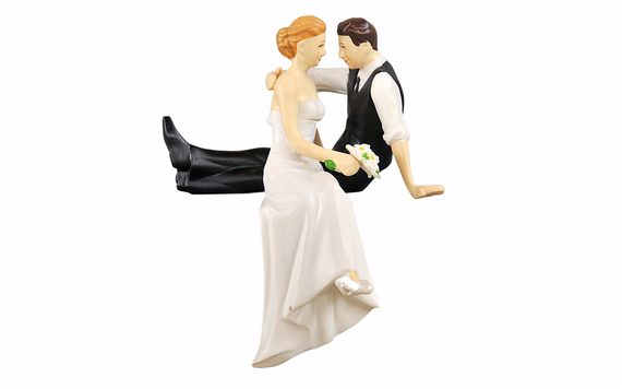 WEDDING CAKE TOPPER - SITTING NEWLYWEDS ON A CAKE EDGE