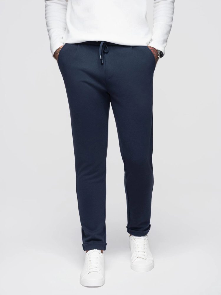 E-shop Elegantné pánske teplákové nohavice modré V1 OM-PACP-0283