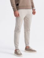 Béžové tepláky s trendy prešívaním V1 PABS-0173