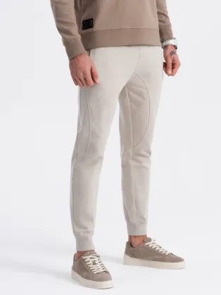 Béžové tepláky s trendy prešívaním V1 PABS-0173