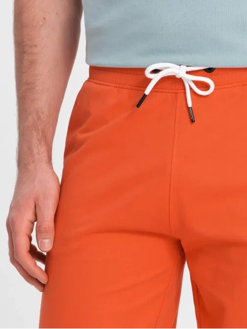 Oranžové teplákové kraťasy V5 SRSK-0105